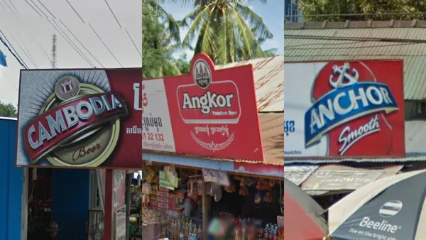 Реклама пивных брендов Angkor, Anchor и Cambodia Beer на стене