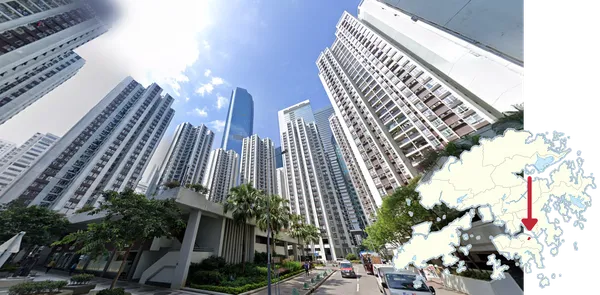 Белые и коричневые многоквартирные дома и стеклянные офисные башни в Quarry Bay