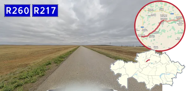 Трасса R260 на пасмурной степи: плохой асфальт, трещины, без разметки