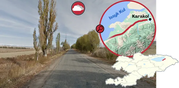 Дорога к западу от Каракола, поля и дальние горы Тянь-Шаня на севере