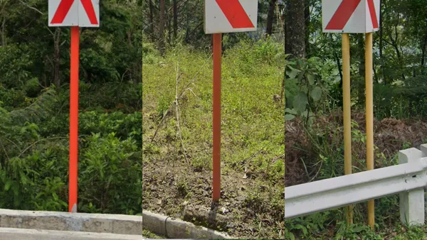 Дорожные указатели красного, оранжевого и желтого цвета на улице