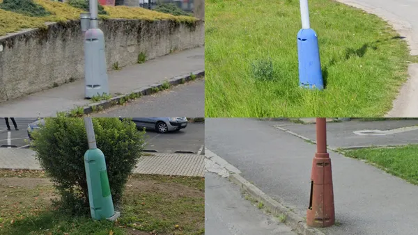 Фонарный столб с толстым основанием на паре болтов, закреплен на тротуаре