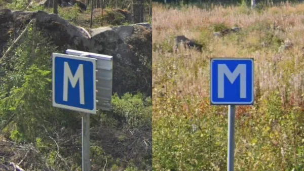 Синие дорожные знаки с большой белой буквой M на маленькой дороге